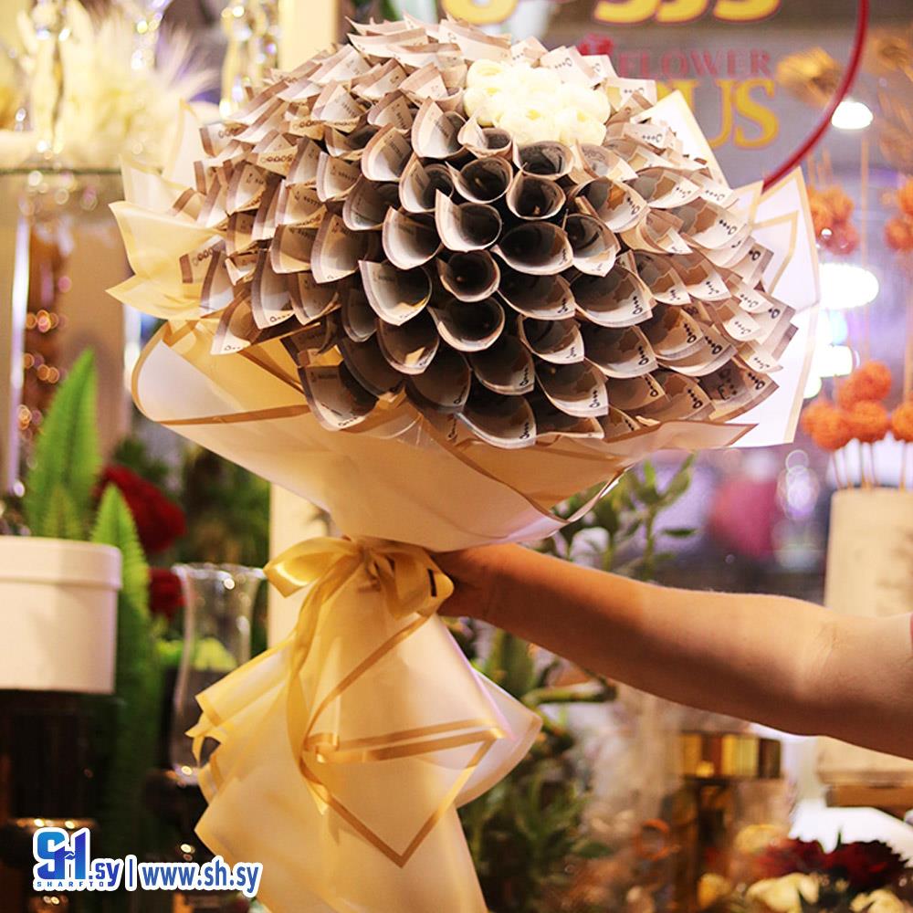 تزيين باقات نقود  (أزهار الوروس)